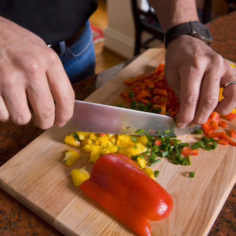 Chopping up peppers and spring onions