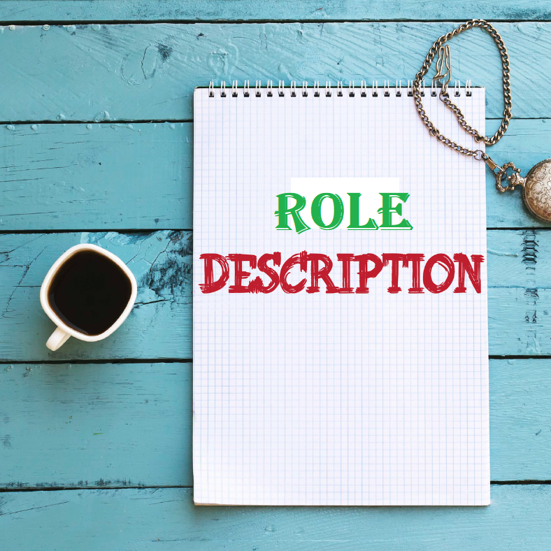 Desk with notepad and words 'role description'. Cup of coffee to one side.
